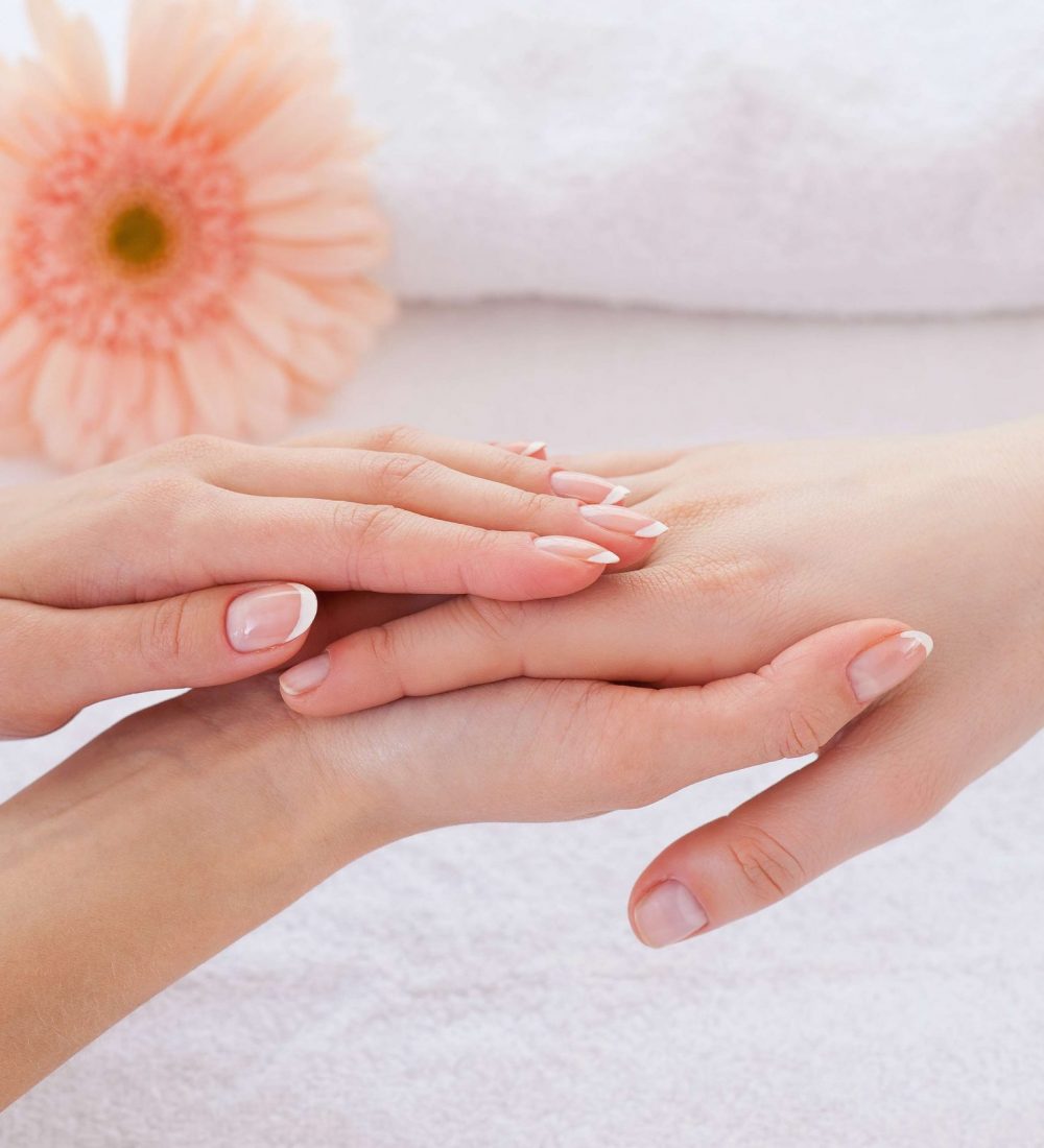 Hands care. Close-up of massage therapist massaging hands of female customer